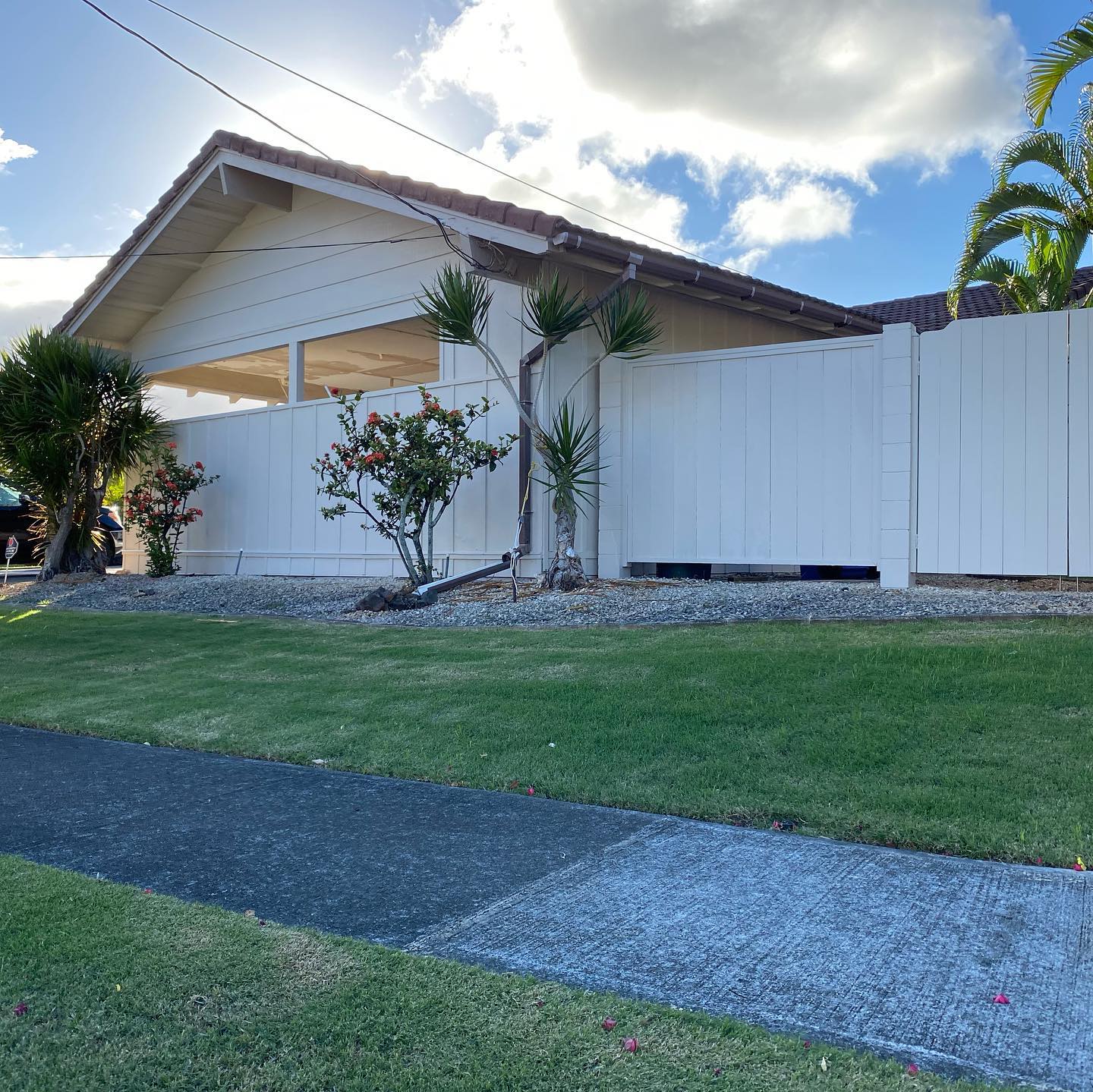 Freshly repainted white plantation-style home exterior